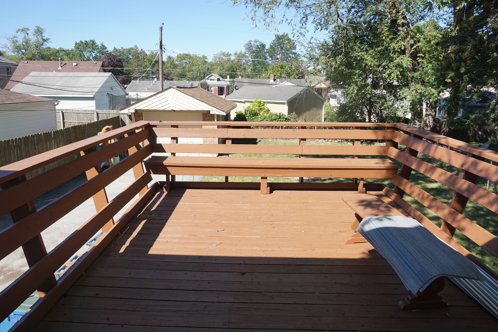 14542 Turner Avenue Midlothian, IL 60445 - Photo 18 of 20 a view of a balcony with wooden floor and outdoor seating