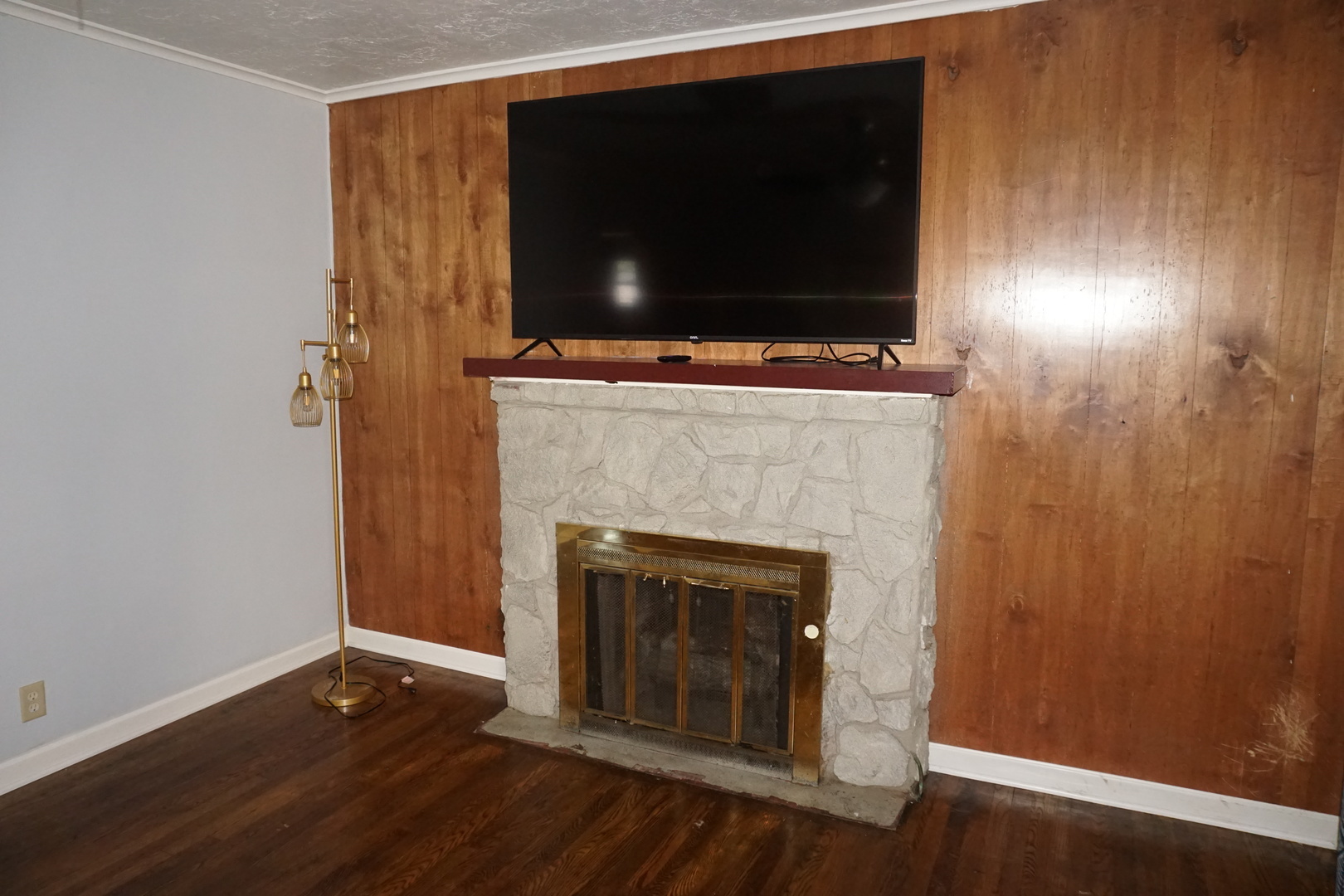 14542 Turner Avenue Midlothian, IL 60445 - Photo 5 of 20 a living room with a fireplace and a flat screen tv