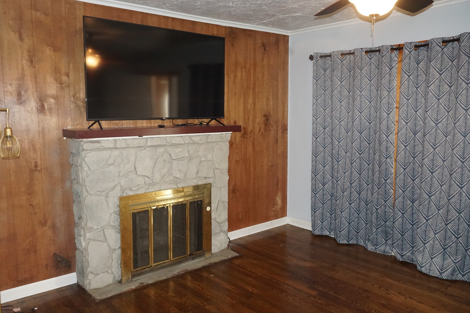 14542 Turner Avenue Midlothian, IL 60445 - Photo 6 of 20 a living room with a fireplace and a flat screen tv