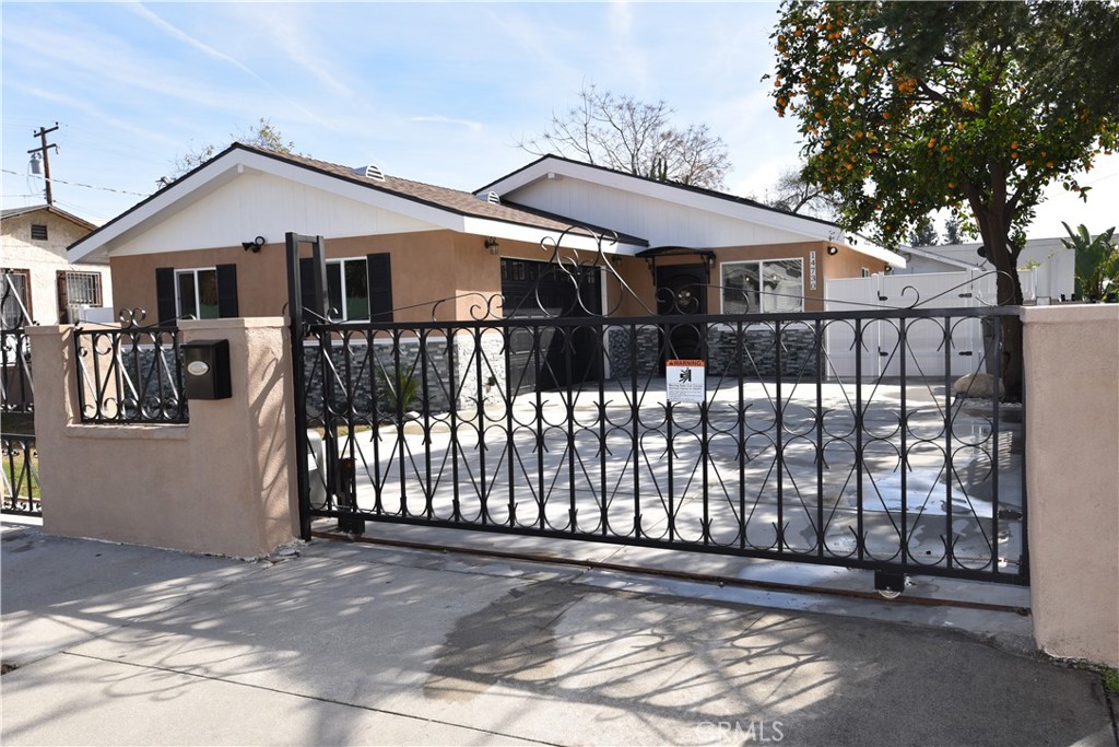 14730 Clark Street Baldwin Park, CA 91706 - Photo 3 of 5 a front view of a house with a yard