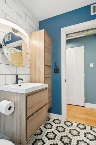 a bathroom with a sink and a mirror