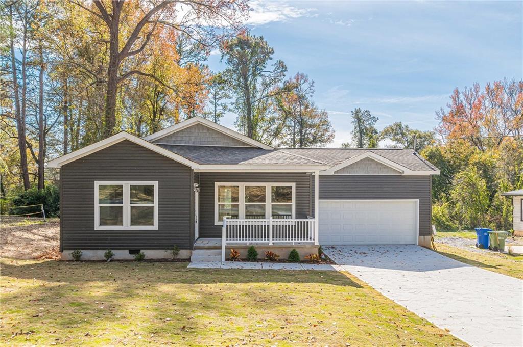 515 McWilliams Road Southeast Atlanta, GA 30315 - Photo 1 of 1 Single story home with a front yard and a garage
