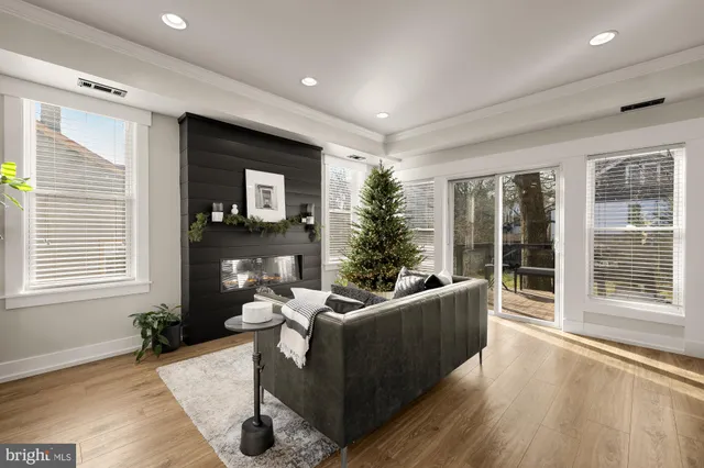 a bedroom with furniture and a fireplace