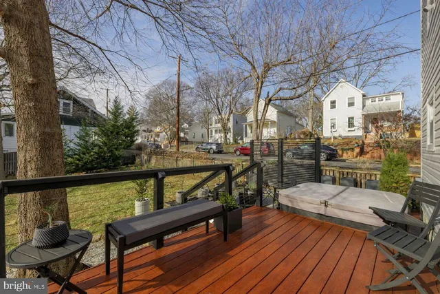a view of a chairs and table on the wooden deck