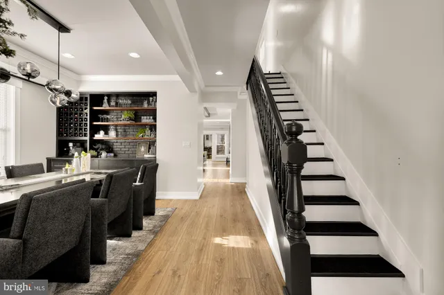 a view of a kitchen with furniture and staircase