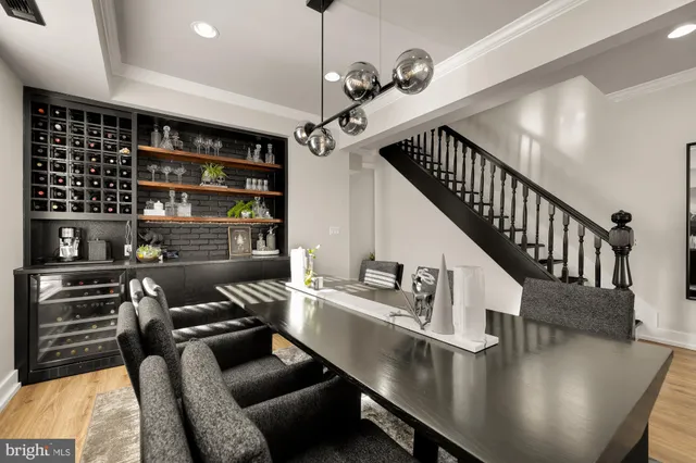 a dining room with furniture and wooden floor