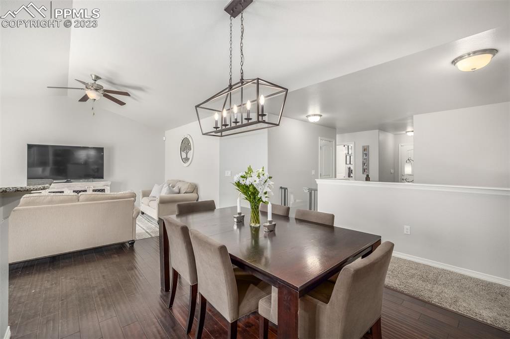 17835 Mining Way Monument, CO 80132 - Photo 17 of 49 a view of a dining room with furniture and a chandelier