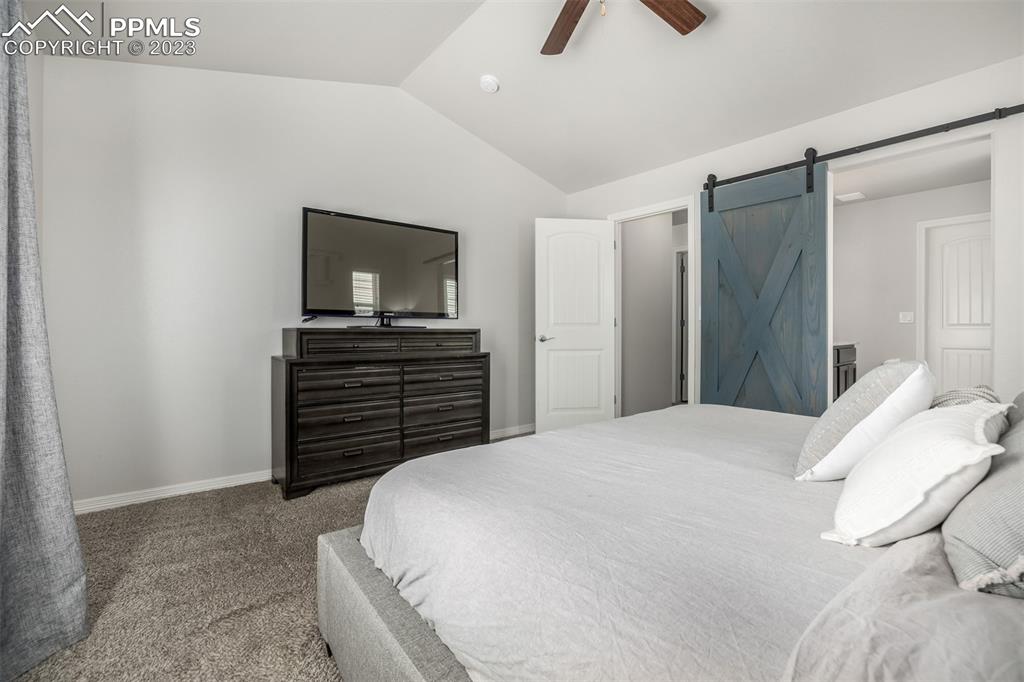17835 Mining Way Monument, CO 80132 - Photo 22 of 49 a bedroom with a bed and a television