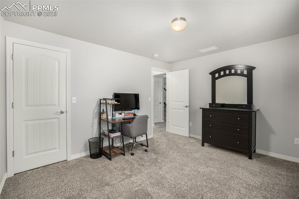 17835 Mining Way Monument, CO 80132 - Photo 29 of 49 a living room with furniture and a flat screen tv