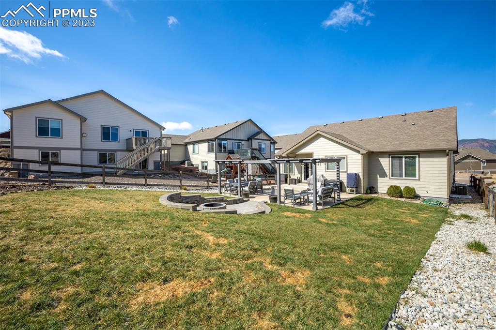 17835 Mining Way Monument, CO 80132 - Photo 45 of 49 a view of a house with swimming pool and a yard