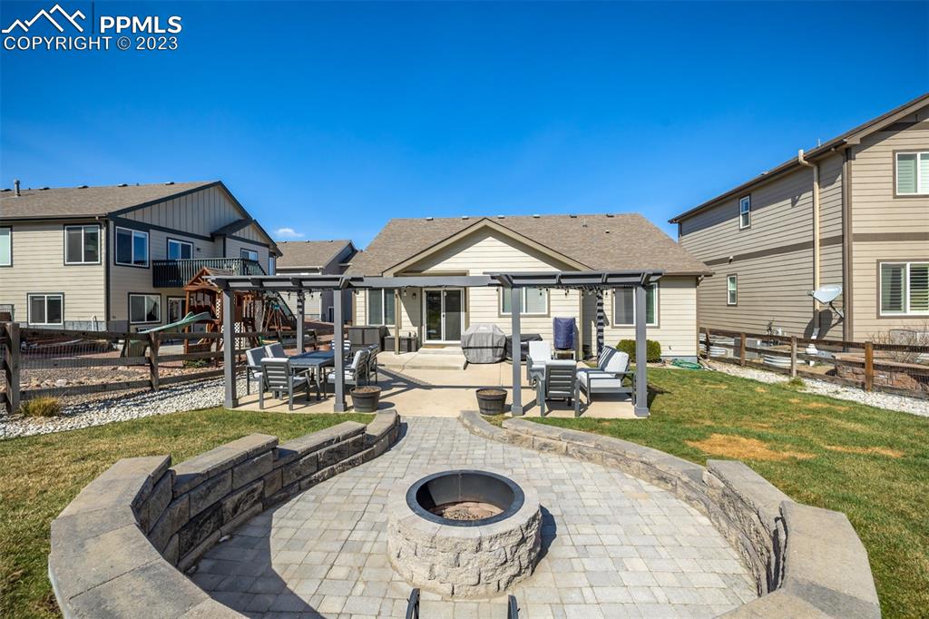 17835 Mining Way Monument, CO 80132 - Photo 47 of 49 a view of a house with swimming pool and porch