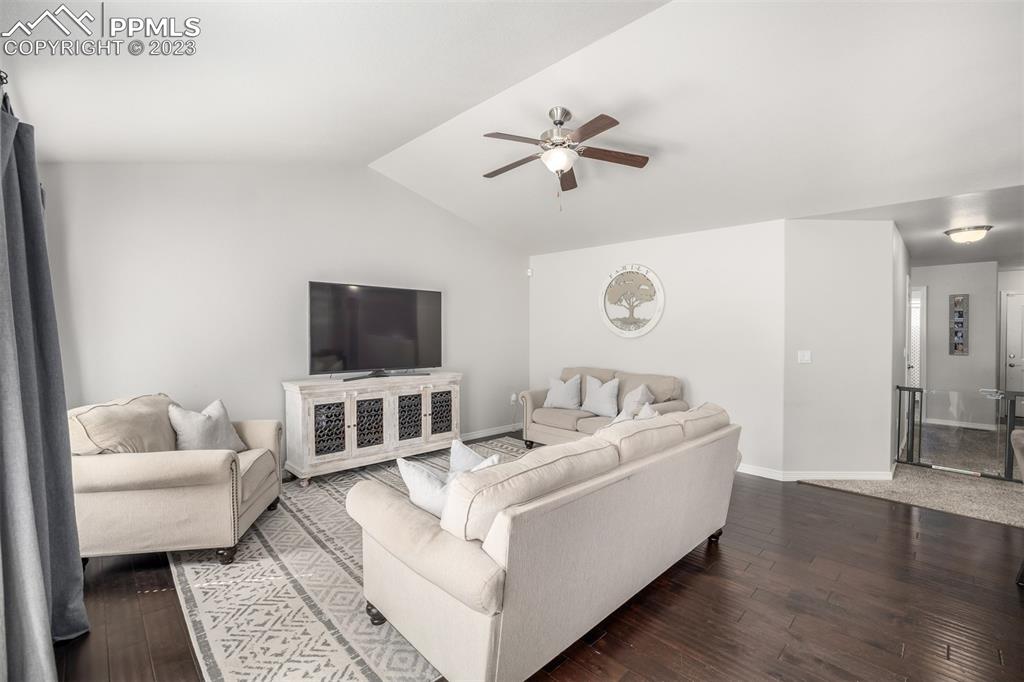 17835 Mining Way Monument, CO 80132 - Photo 6 of 49 a living room with furniture and a flat screen tv