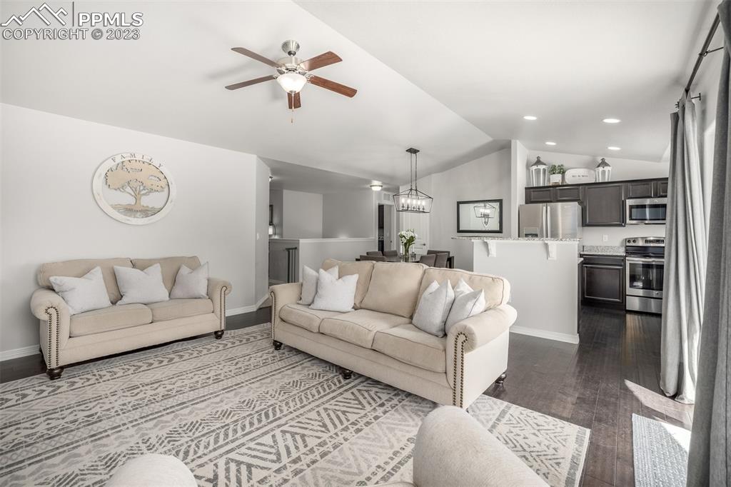17835 Mining Way Monument, CO 80132 - Photo 7 of 49 a living room with furniture kitchen and a table