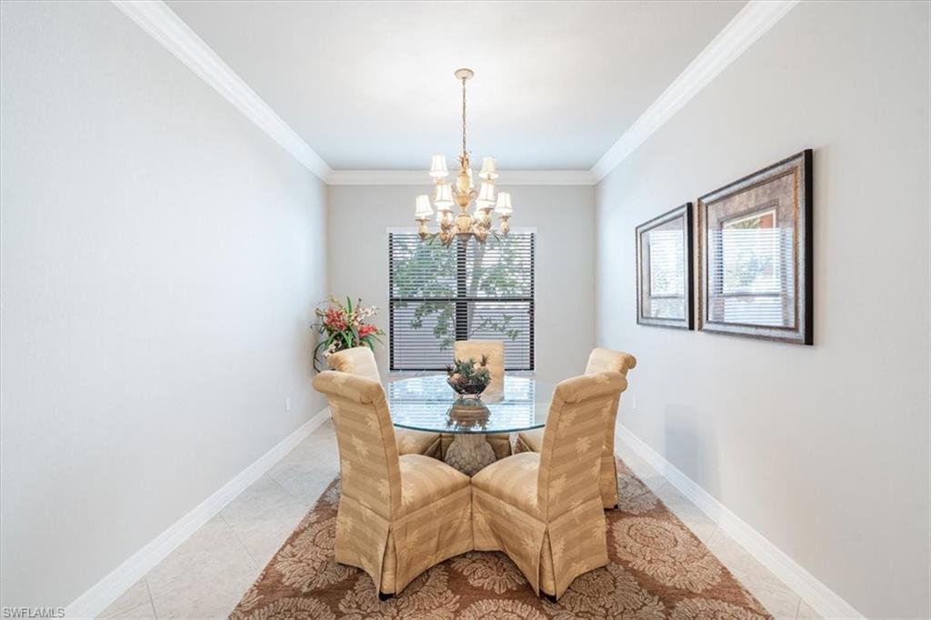 13576 Mandarin Circle Naples, FL 34109 - Photo 12 of 24 a dining room with furniture and window