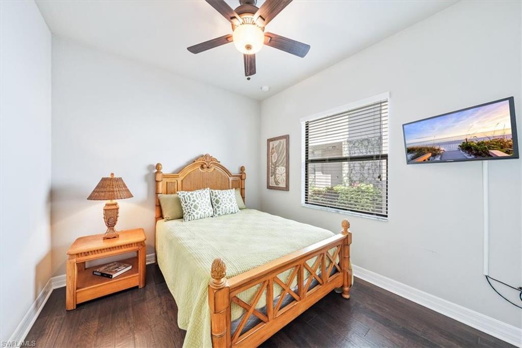 13576 Mandarin Circle Naples, FL 34109 - Photo 20 of 24 a bedroom with a bed and a window