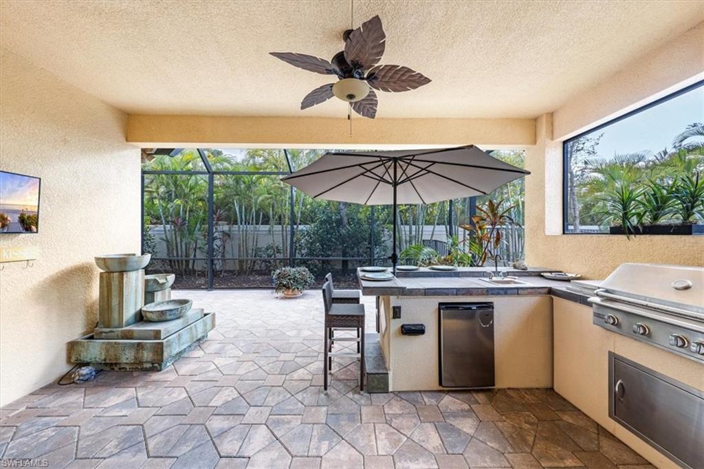 13576 Mandarin Circle Naples, FL 34109 - Photo 21 of 24 a view of a kitchen with a sink and dishwasher