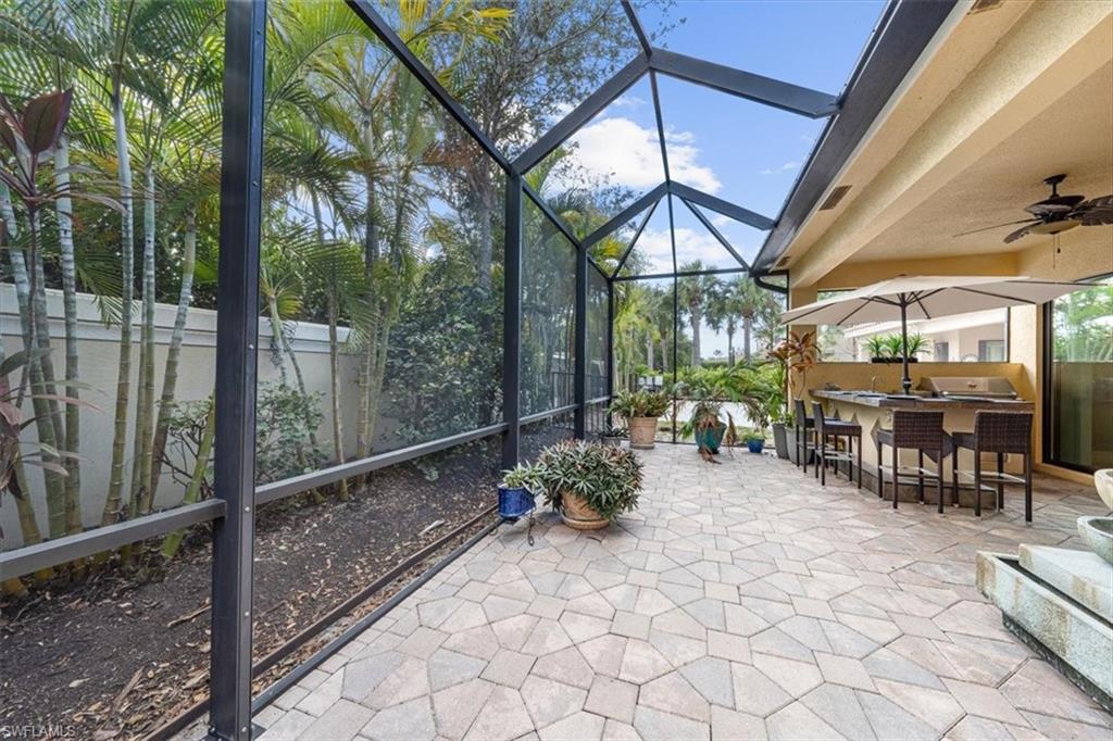 13576 Mandarin Circle Naples, FL 34109 - Photo 23 of 24 a room with lots of table and chairs
