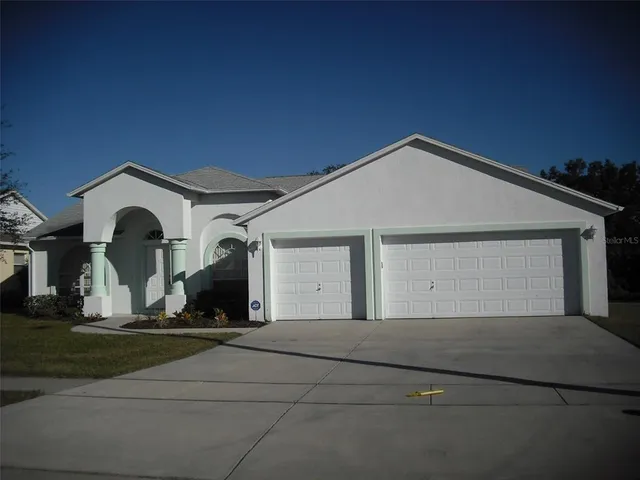 a view of a house with a garage