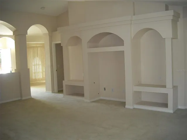 a view of empty room with windows