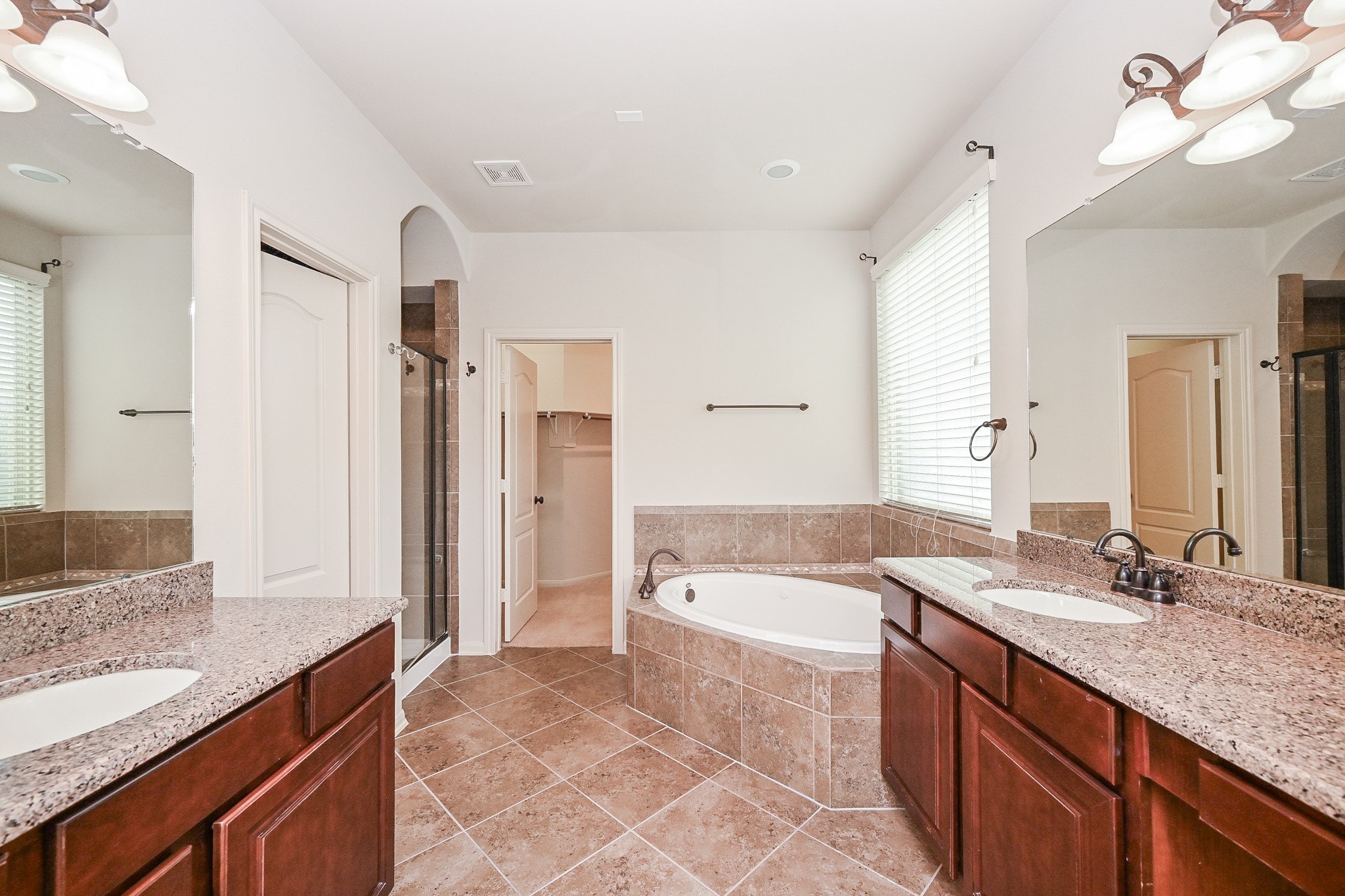 19 Sandwell Place Spring, TX 77389 - Photo 20 of 33 Primary suite with dual vanities, jetted tub, glass enclosed shower and walk in closet