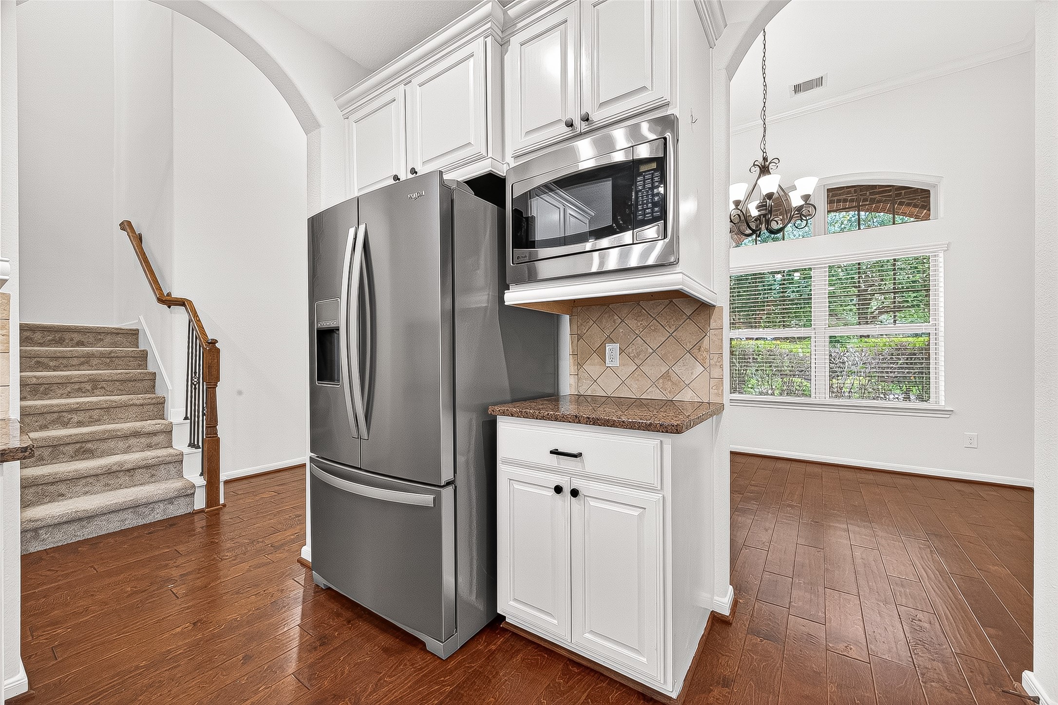 138 South Sawbridge Circle Spring, TX 77389 - Photo 17 of 37 a kitchen with stainless steel appliances a refrigerator microwave and sink