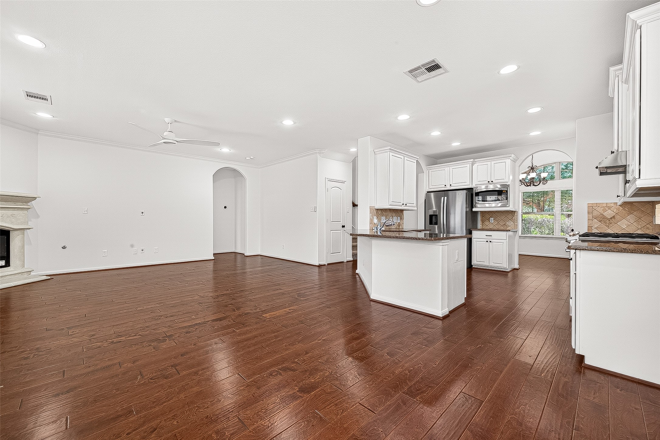 138 South Sawbridge Circle Spring, TX 77389 - Photo 7 of 37 a view of kitchen view wooden floor stainless steel appliances and cabinets