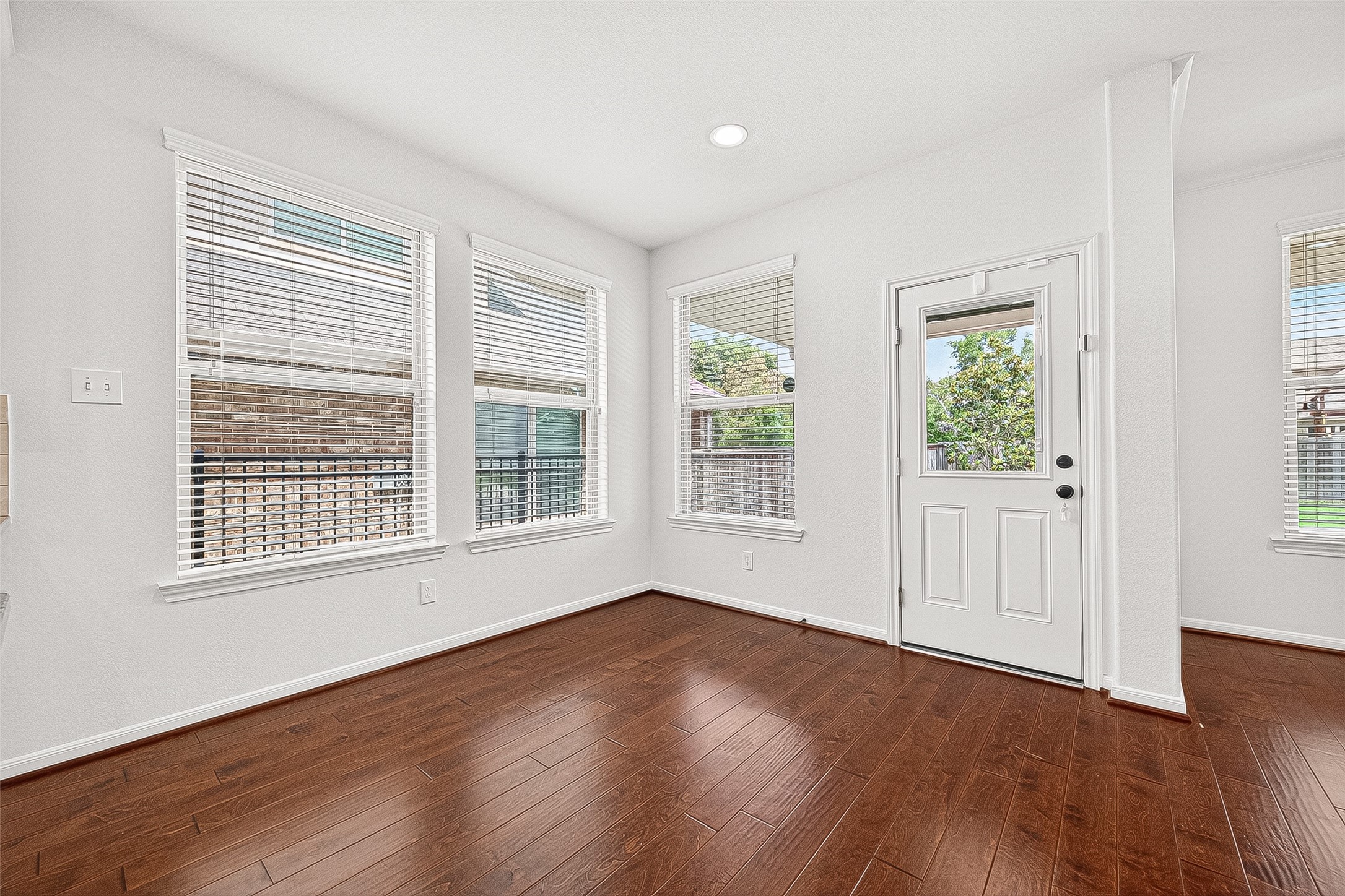 138 South Sawbridge Circle Spring, TX 77389 - Photo 9 of 37 a view of an empty room with wooden floor and a window