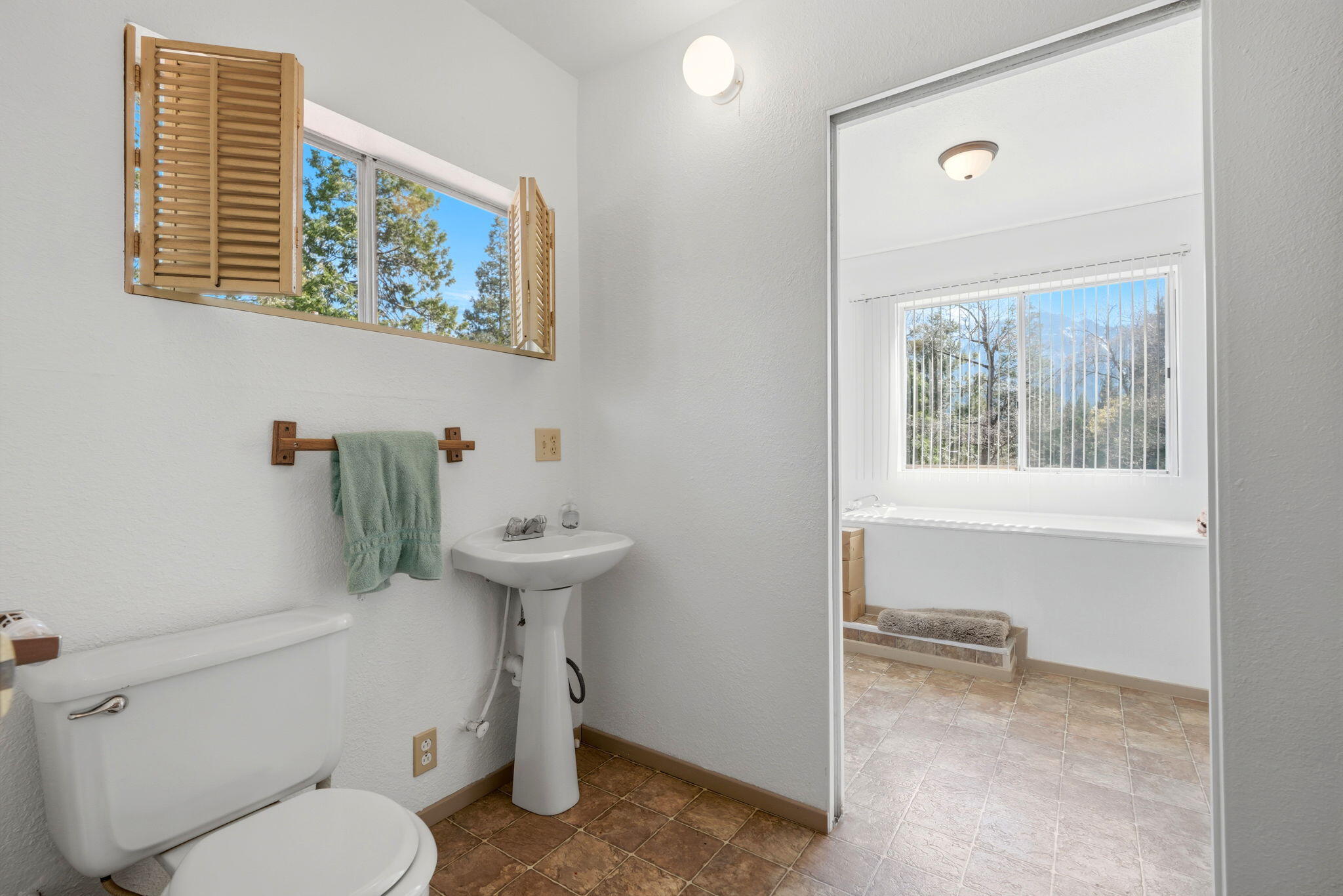 697 Loop Drive Springville, CA 93265 - Photo 23 of 55 a bathroom with a toilet a sink and mirror