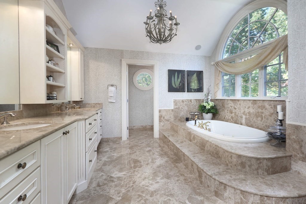 177 Bridle Trail Road Needham, MA 02492 - Photo 16 of 41 a spacious bathroom with a granite countertop sink and a mirror