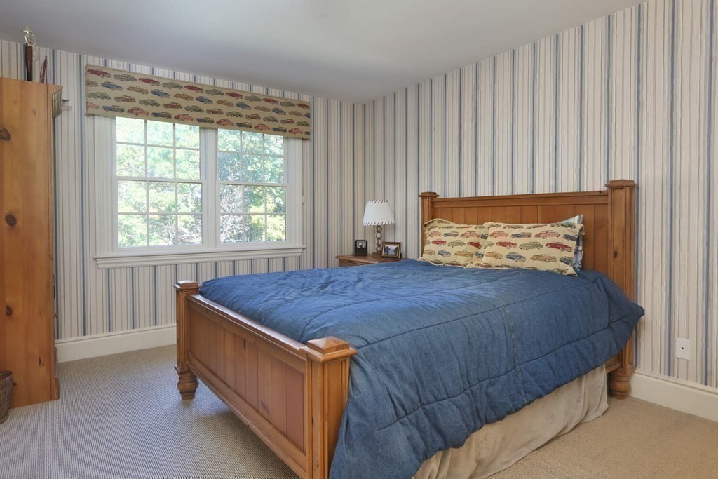 177 Bridle Trail Road Needham, MA 02492 - Photo 21 of 41 a bed sitting in a bedroom next to a window