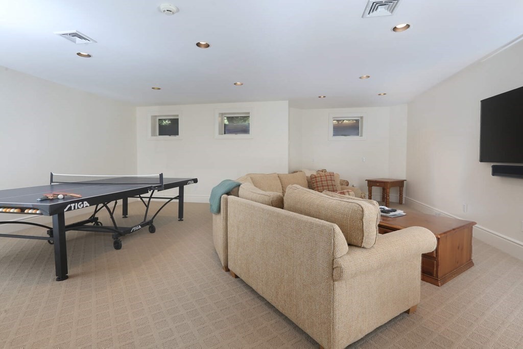 177 Bridle Trail Road Needham, MA 02492 - Photo 23 of 41 a living room with furniture and a flat screen tv