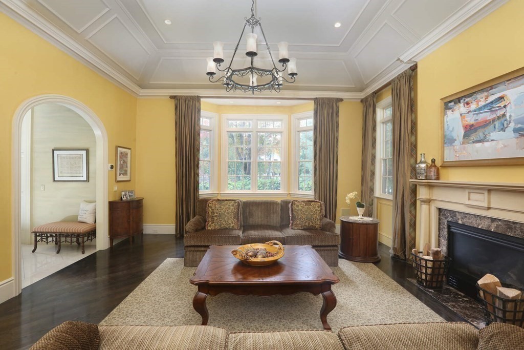 177 Bridle Trail Road Needham, MA 02492 - Photo 7 of 41 a living room with furniture and a chandelier