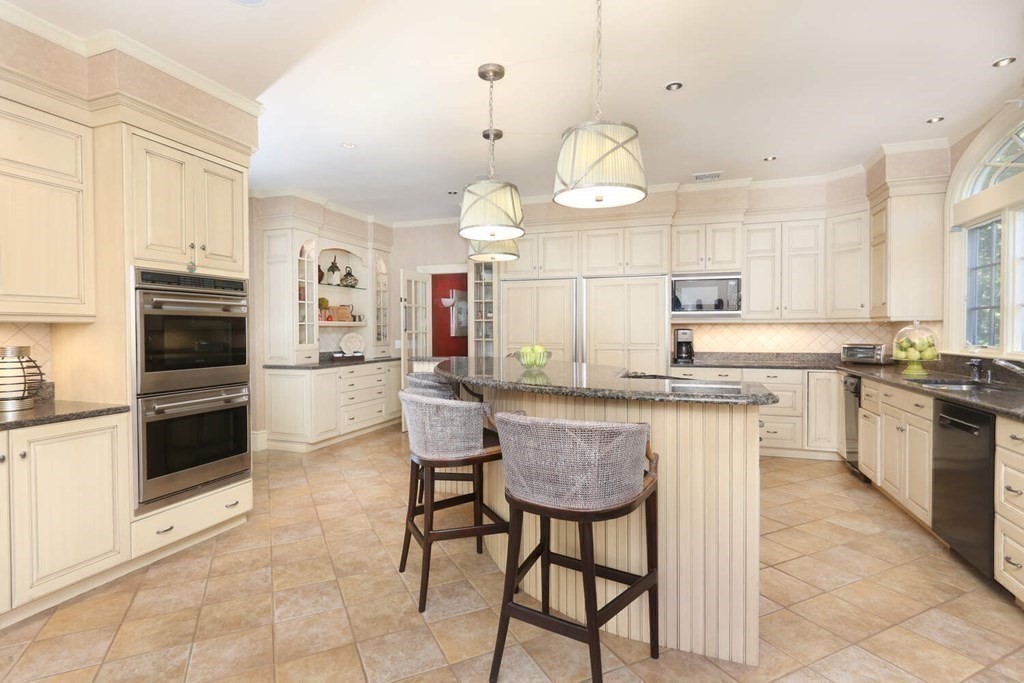 177 Bridle Trail Road Needham, MA 02492 - Photo 10 of 41 a kitchen with granite countertop a sink cabinets stainless steel appliances and a window