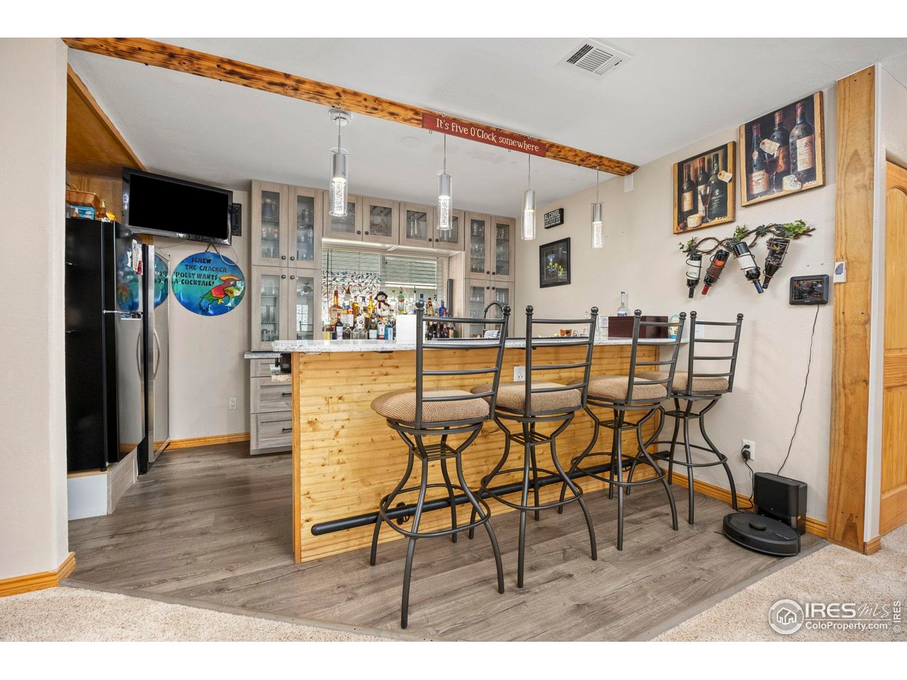 210 2nd Street Mead, CO 80542 - Photo 12 of 29 a dining room with furniture and wooden floor