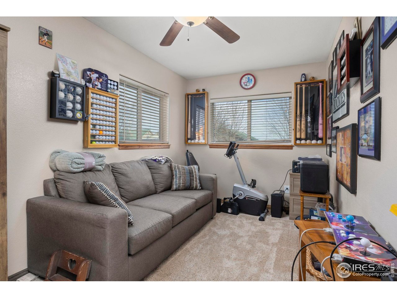 210 2nd Street Mead, CO 80542 - Photo 16 of 29 a living room with furniture and a flat screen tv