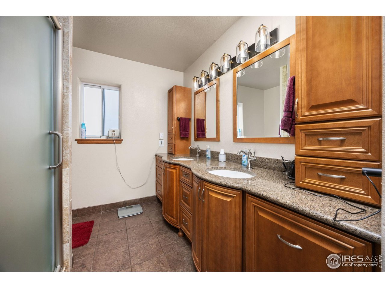 210 2nd Street Mead, CO 80542 - Photo 18 of 29 a bathroom with a sink a toilet and a mirror