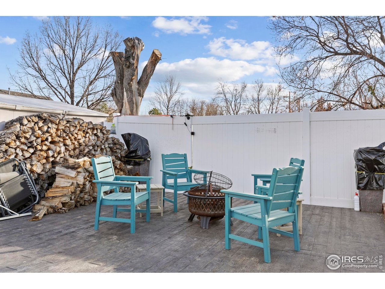210 2nd Street Mead, CO 80542 - Photo 27 of 29 a living room with furniture and a chandelier