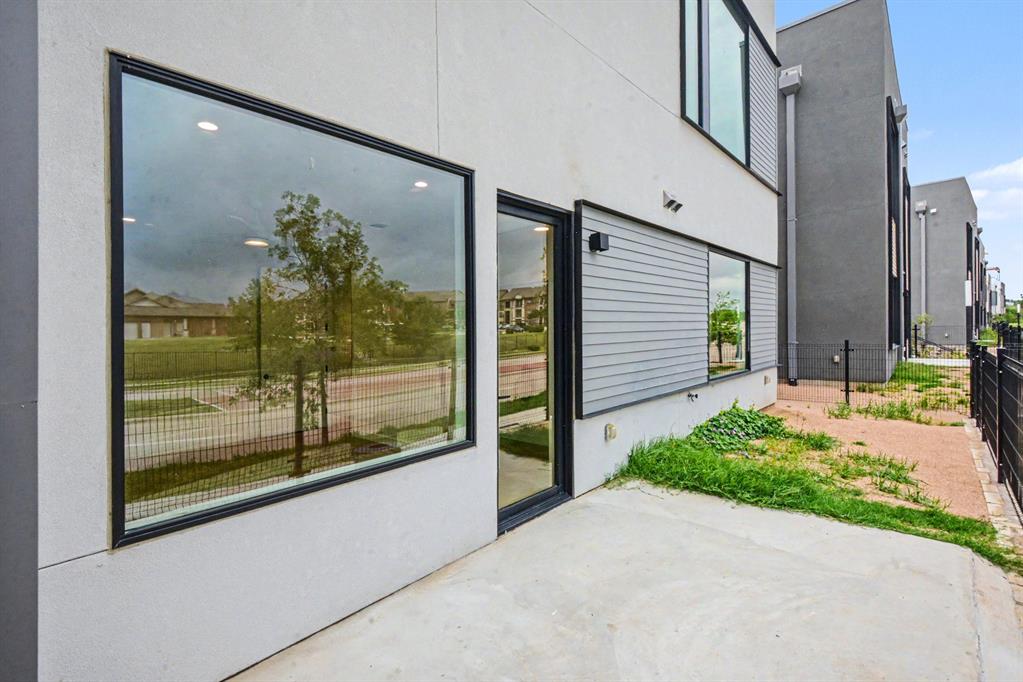 1111 Raiford Road, Unit 121 Carrollton, TX 75007 - Photo 25 of 30 a view of a potted plant in front of a building