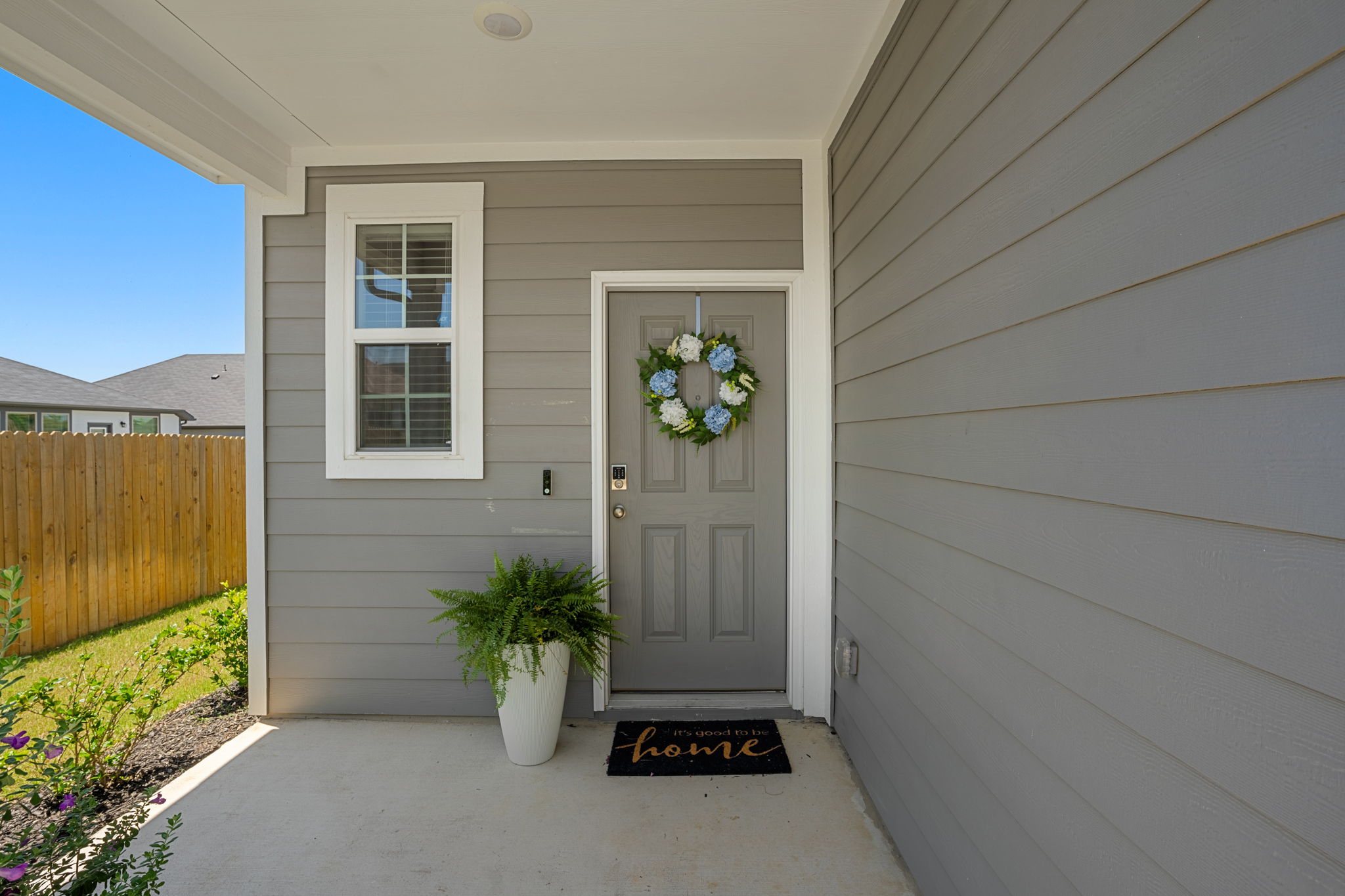 148 Hidalgo Lane Elgin, TX 78621 - Photo 6 of 38 A welcoming entry, with a subtle wreath adorning the front door.