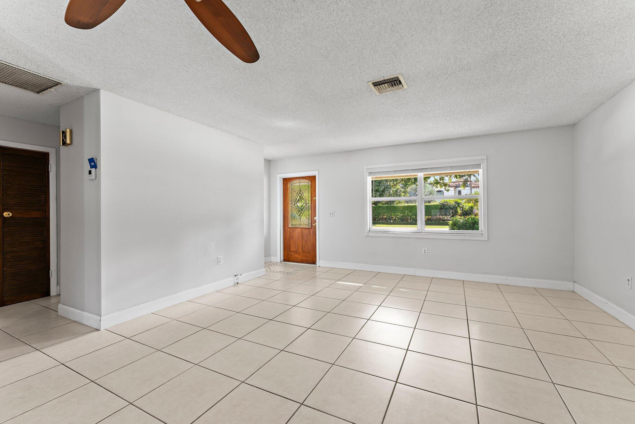243 West Riverside Drive Jupiter, FL 33469 - Photo 11 of 67 an empty room with windows and closet