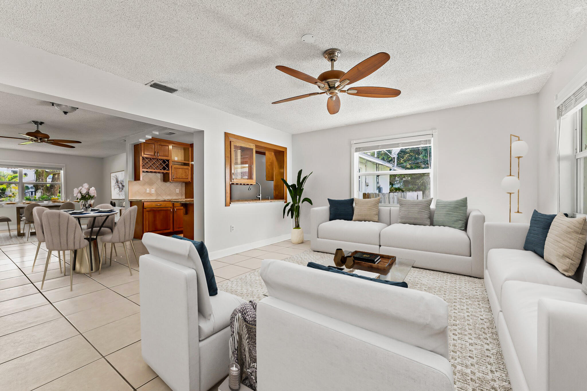 243 West Riverside Drive Jupiter, FL 33469 - Photo 15 of 67 a living room with furniture and a large window