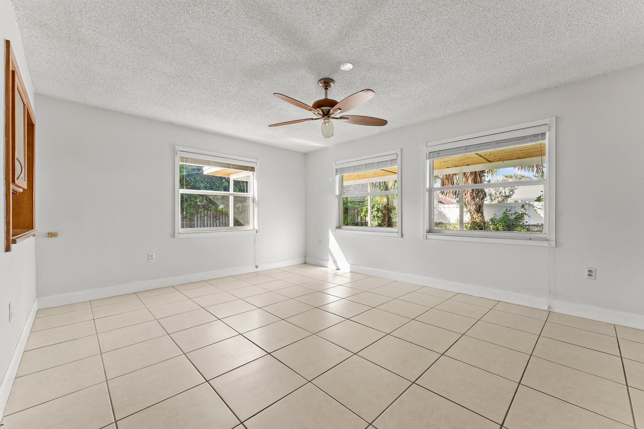 243 West Riverside Drive Jupiter, FL 33469 - Photo 18 of 67 a view of an empty room with a window