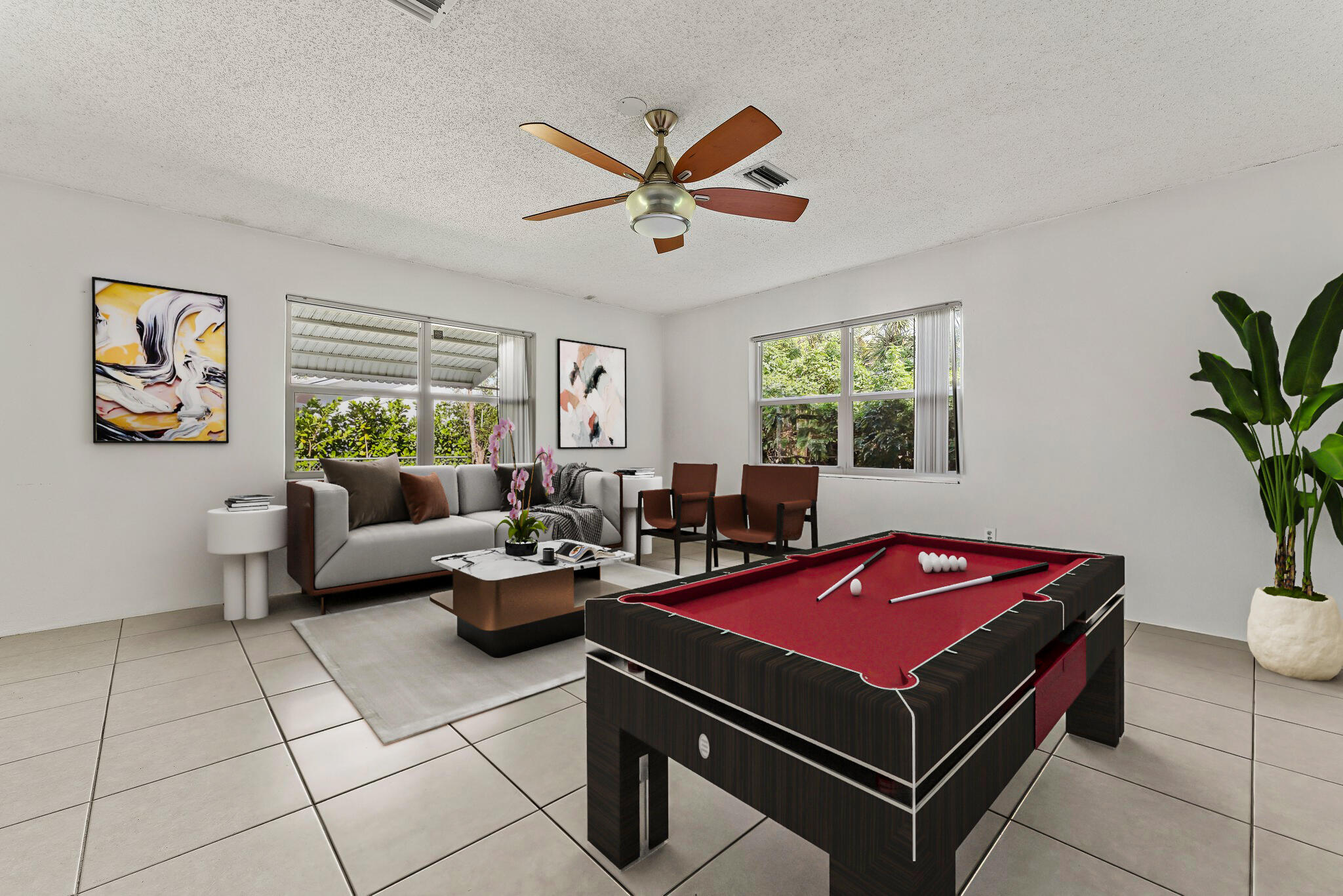 243 West Riverside Drive Jupiter, FL 33469 - Photo 26 of 67 a living room with furniture a table and a potted plant