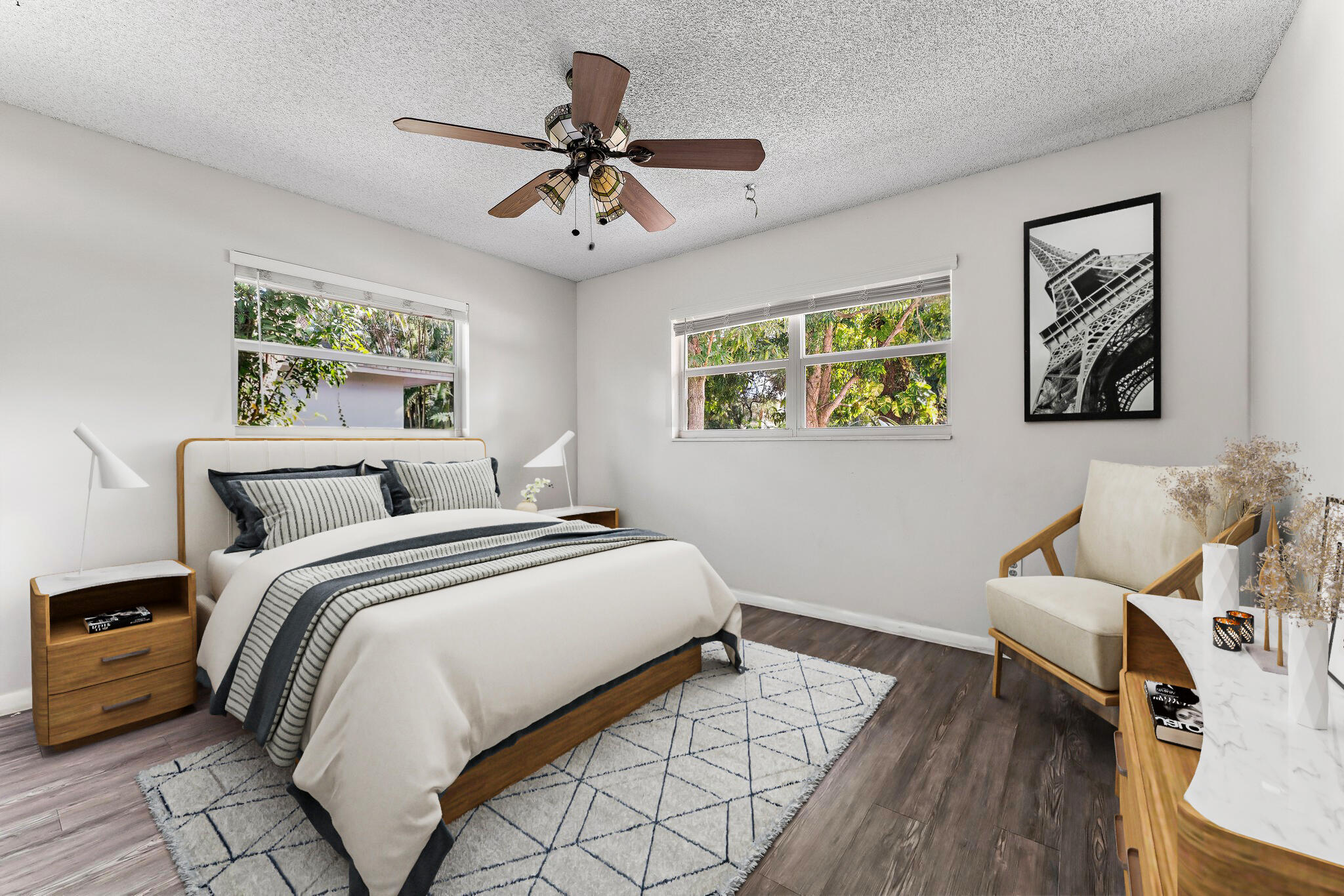 243 West Riverside Drive Jupiter, FL 33469 - Photo 33 of 67 a bedroom with bed and a chandelier
