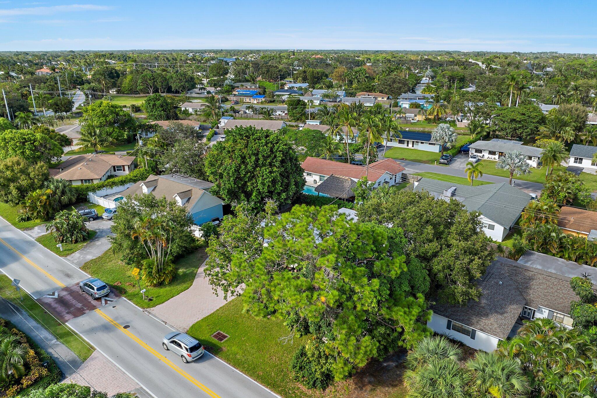 243 West Riverside Drive Jupiter, FL 33469 - Photo 53 of 67 an aerial view of residential houses with outdoor space and street view