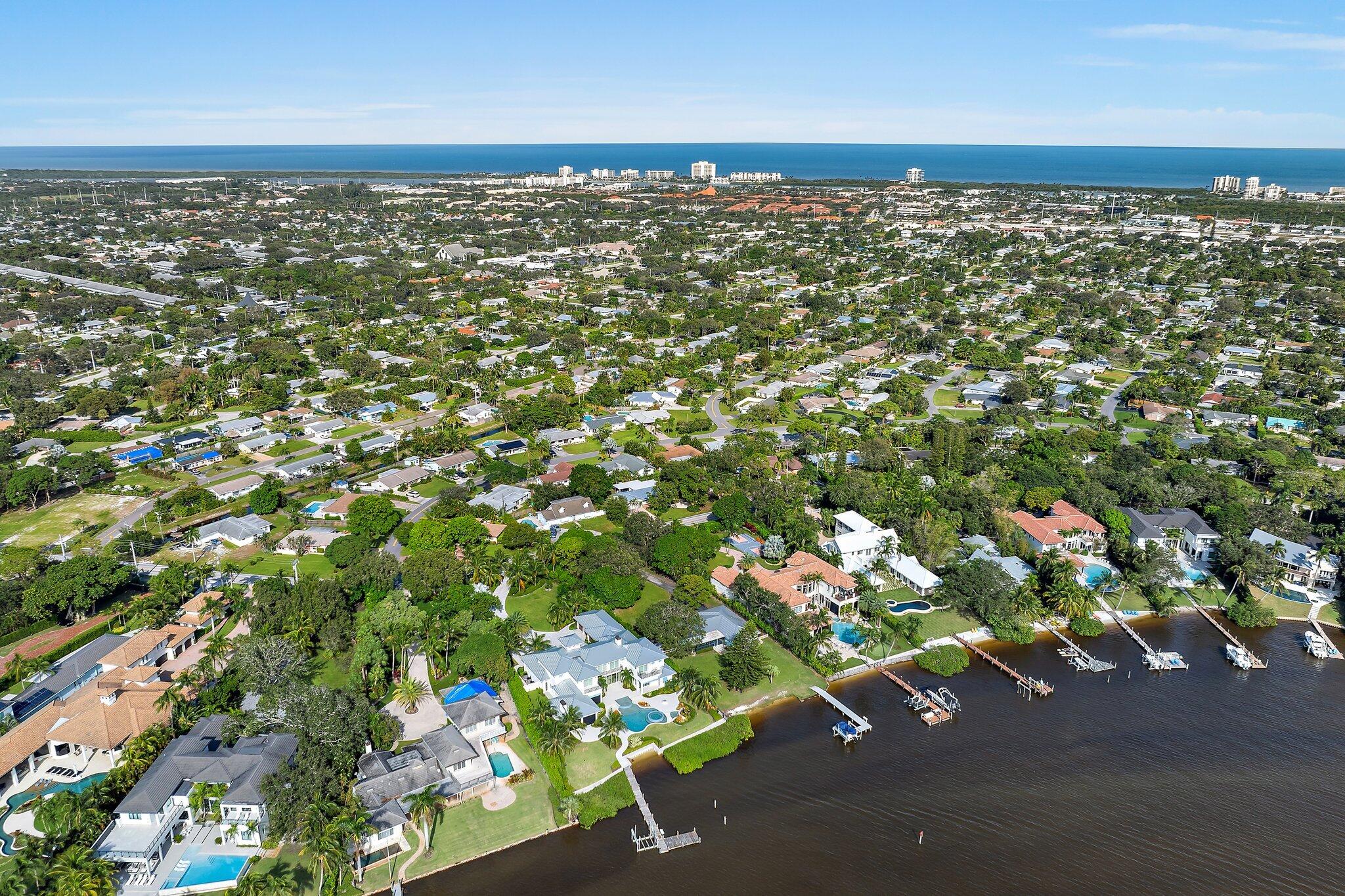 243 West Riverside Drive Jupiter, FL 33469 - Photo 60 of 67 an aerial view of a houses with a yard