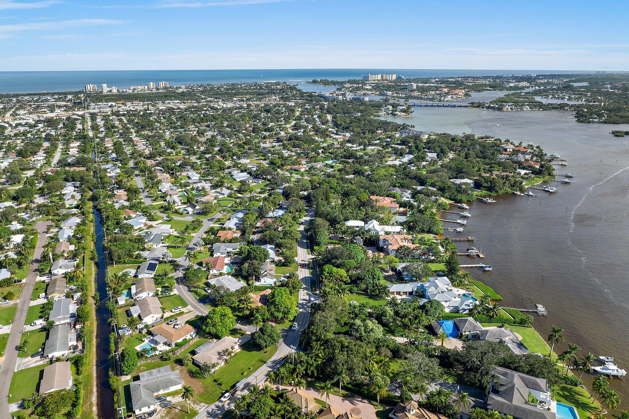243 West Riverside Drive Jupiter, FL 33469 - Photo 61 of 67 an aerial view of a city with lots of residential buildings