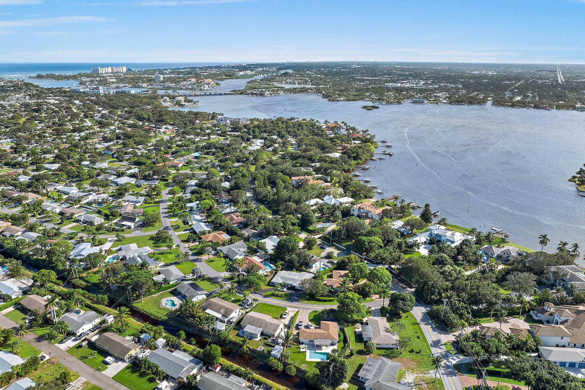 243 West Riverside Drive Jupiter, FL 33469 - Photo 62 of 67 an aerial view of a city with lots of residential buildings
