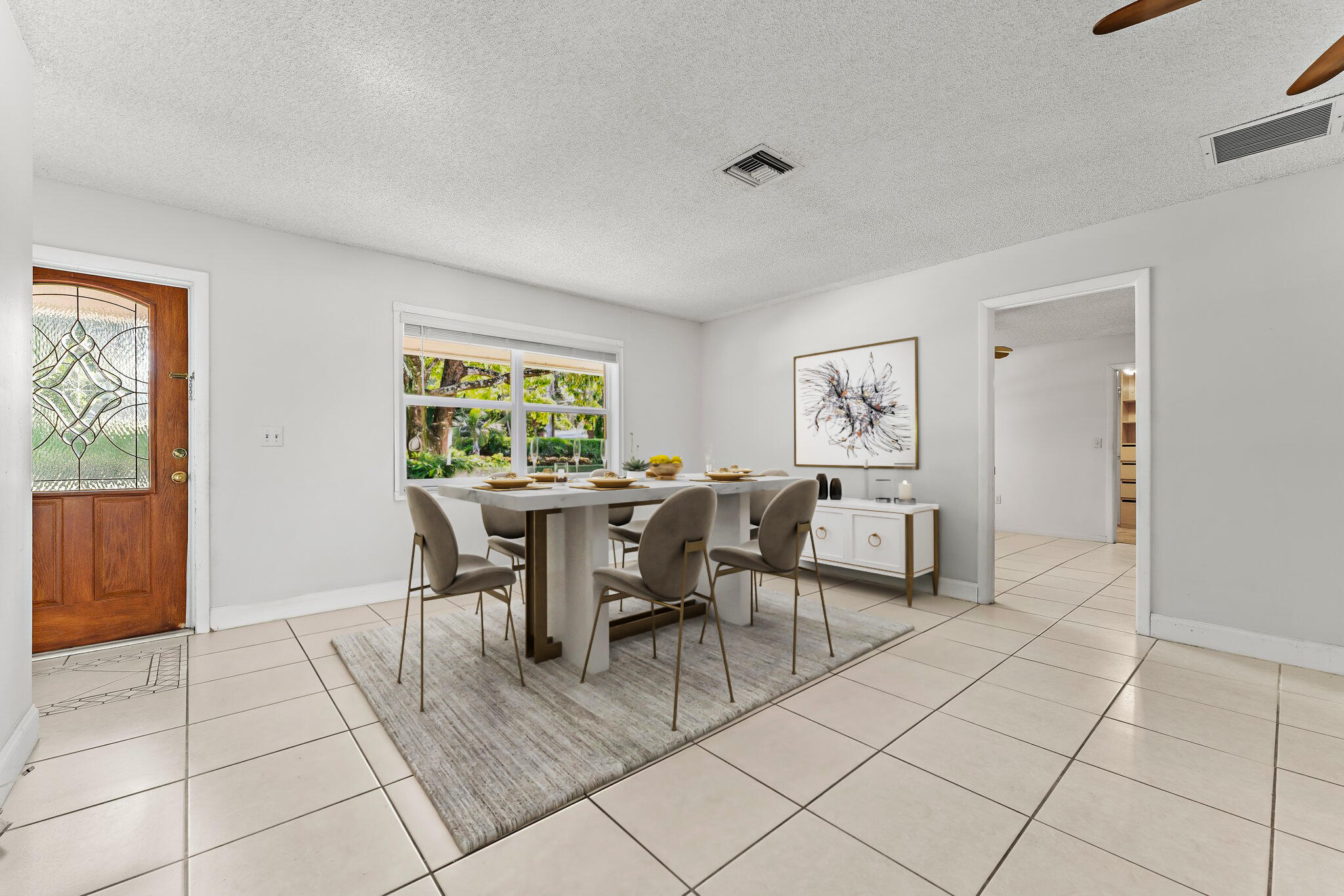 243 West Riverside Drive Jupiter, FL 33469 - Photo 9 of 67 a dining room with chandelier and glass door