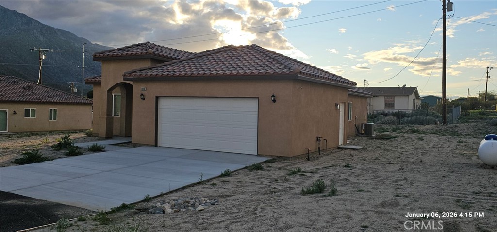 13449 Mesquite Road Whitewater, CA 92282 - Photo 3 of 13 a front view of a house with a yard
